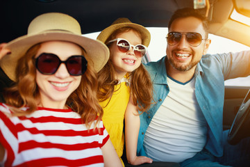 happy   family  in summer auto journey travel by car on beach
