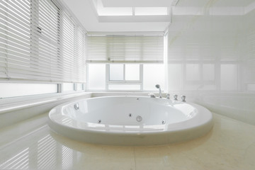 Condo bathroom design with single vanity cabinet and grey tiles on the walls.