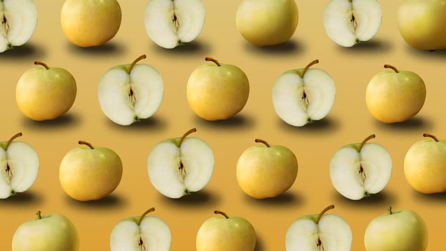 Colorful fruit pattern of fresh yellow apples on yellow background. 4k video.