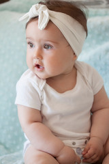 Portrait of 8 month old baby with bandanas