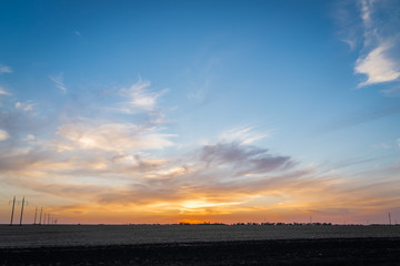 Golden sunset over rural landscape