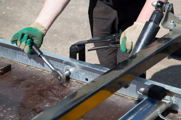 Open car trailer. Trailer store. Assembly of car trailers.