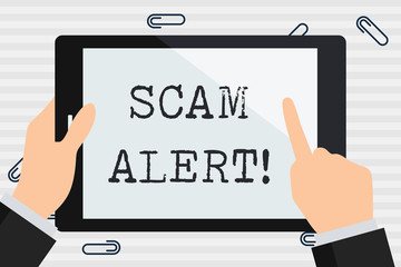 Handwriting text Scam Alert. Conceptual photo fraudulently obtain money from victim by persuading him Businessman Hand Holding, Pointing and Touching Colorful Tablet Blank Screen