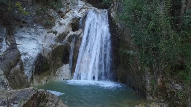 Drone shot of a waterfall feeding a stream at Lassa, Mount Lebanon