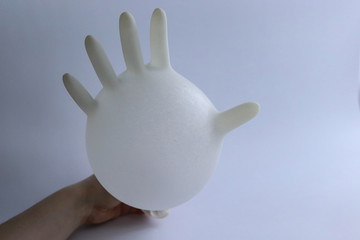disposable sterile white gloves on white background
