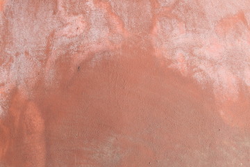 Wall plastered with mortar finished by hand in brown color