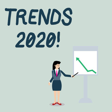Conceptual hand writing showing Trends 2020. Concept meaning general direction in which something is developing or changing Woman Holding Stick Pointing to Chart of Arrow on Whiteboard