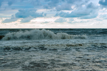 Sea coast. Tides and storms at sea. Waves on the Baltic Sea. Deserted seashore.