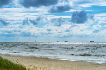 Sea coast. Tides and storms at sea. Waves on the Baltic Sea. Deserted seashore.