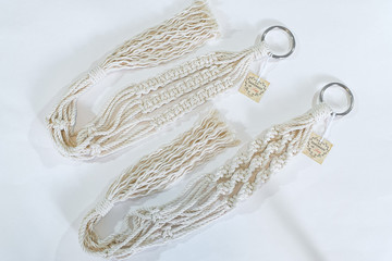 Two 3mm handmade cotton macrame plant hangers being displayed on a white background.