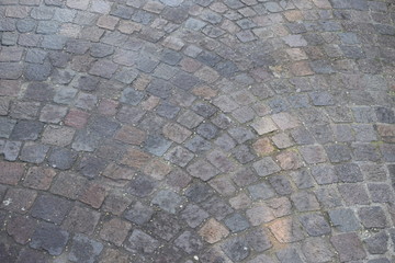 Top view on background texture of straight gray flat stone brick paving stone street street outdoor copyspace, horizontal image