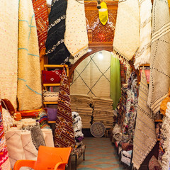 Traditional african arabian moroccan marrakech carpet market, shop with carpets and textile...