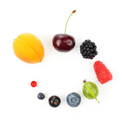 different juicy berries laid out in a circle on a white background