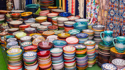 Traditional Moroccan marrakech market with plates and tajin tagine. Handmade ceramic plates. Arabian colorful ramadan design