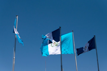 National flag of Guatemala, Central America, to the wind in antler, patriotic symbol, September 12, 1968 current version. Guatemala flag, national symbol, waving on the wind
