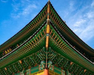 Naklejka premium The corner of a brightly painted roof at Changdeokgung Palace, a Unesco World Heritage site dating from the Joseon dynasty, in Seoul, South Korea