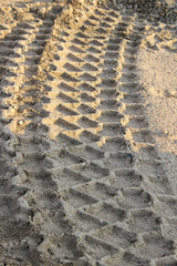 tractor tracks in sand