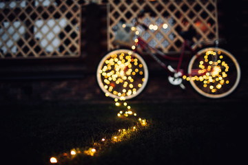 Christmas lights on bike background texture in city