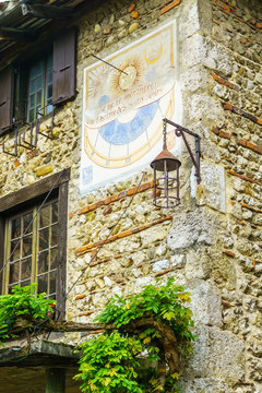 Old sun clock, in the medieval village Perouges