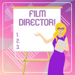 Text sign showing Film Director. Business photo showcasing a demonstrating who is in charge of making and directing a film White Female in Glasses Standing by Blank Whiteboard on Stand Presentation