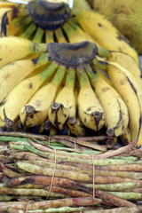 Pods of Black Eye Pea, or Feijao de Corda, and bunch of bananas