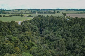 Drone shot of a waterfall in the forest