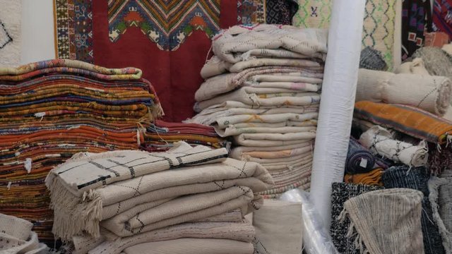 Traditional african arabian moroccan marrakech carpet market, shop with carpets and textile marketplace