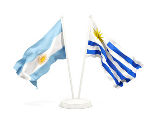 Two waving flags of Argentina and uruguay isolated on white