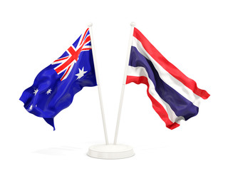 Two waving flags of Australia and thailand isolated on white
