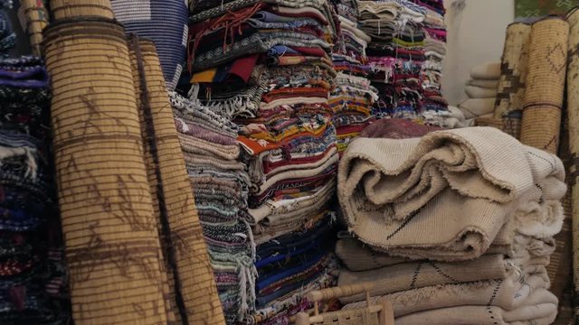 Traditional african arabian moroccan marrakech carpet market, shop with carpets and textile marketplace
