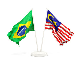 Two waving flags of Brazil and malaysia isolated on white