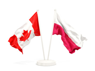 Two waving flags of Canada and poland isolated on white
