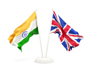 Two waving flags of India and UK isolated on white