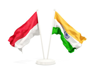 Two waving flags of Indonesia and india isolated on white