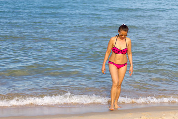 Woman with bikini pink relax on beach