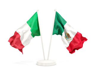 Two waving flags of Italy and mexico isolated on white