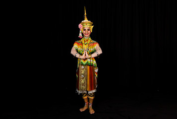 An image with the black background of the actor Manohra is dancing. Manohra is a famous folk dance performance in southern Thailand.