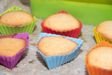 Silicone homemade muffins on parchment. Homemade baking. Sponge cake
