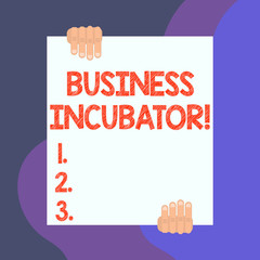 Handwriting text writing Business Incubator. Conceptual photo company that helps new and startup companies to develop Two hands hold one big empty blank white paper placed on top and bottom