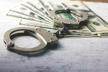 handcuffed money on the table