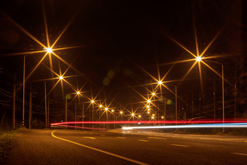 Fototapeta na wymiar Plenty of lights on the road, curves.