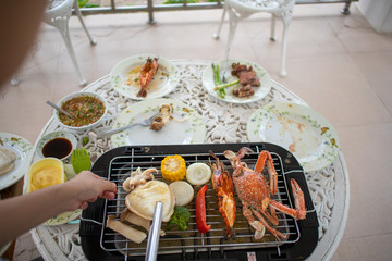 Close up of seafood barbecue on the stove.