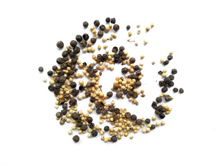 Black peppercorns and coriander seed. Coriander seeds and black pepper on white background....