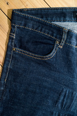 Close up of  blue denim jeans fabric texture background.