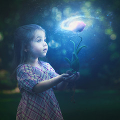 Little girl and galaxy flower