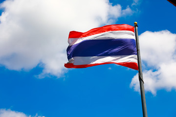 Image of waving Thai flag of Thailand with blue sky background