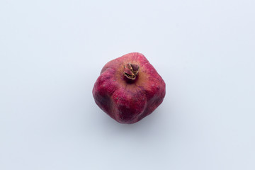 Dried pomegranate isolated on white.