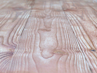 The background of a wooden table with a pronounced texture.