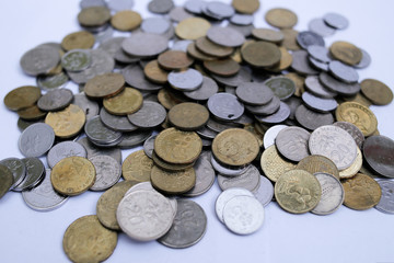 Malaysian coins close up over white background