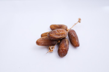 Kurma or dates fruits isolated on white background